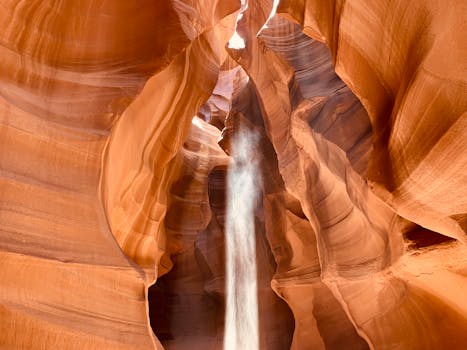 Stunning sandstone formations and light beams at Upper Antelope Canyon.