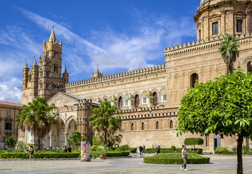 Bright day view of the historic Palermo Cathedral in Sicily, showcasing its impressive architectural details.