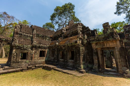 Explore the ancient ruins of the Angkor Wat complex in Cambodia, showcasing historical architecture.