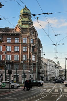 Street view of historical architecture and urban life in Krakow, Poland.